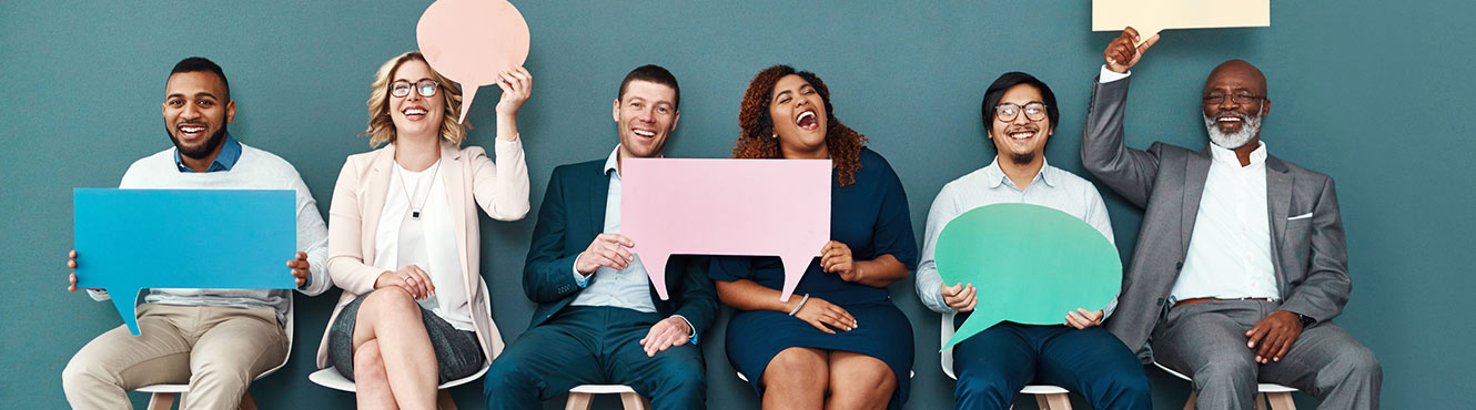 Group of people holding speech bubbles.