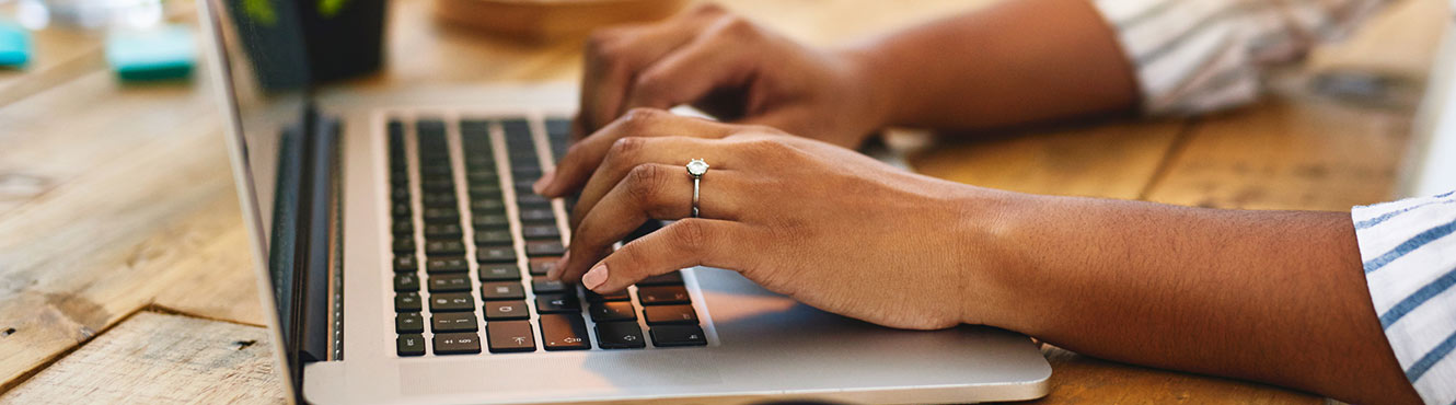 Woman's hands on laptop