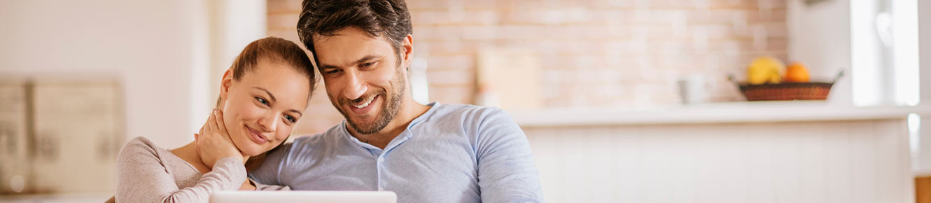 Couple on laptop at home