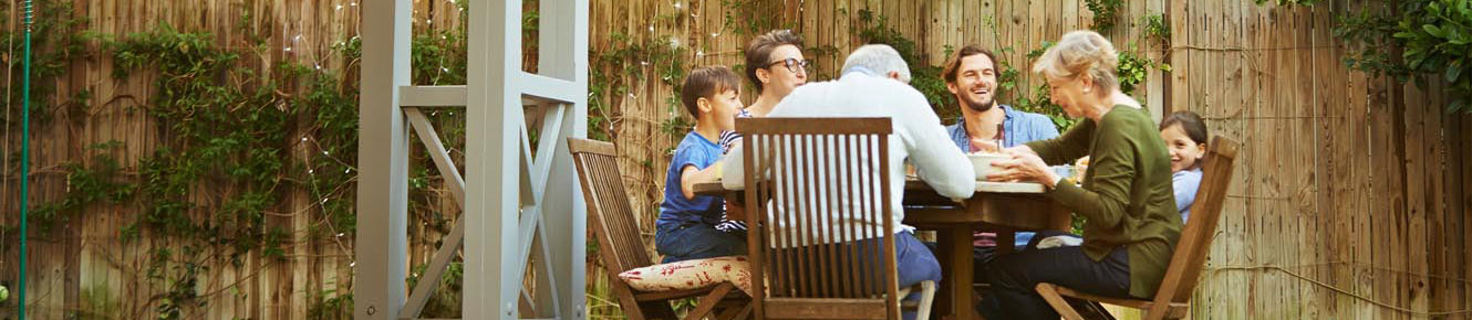 family dining in backyard