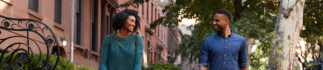 couple walking down sidewalk